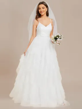 Robe de mariée en tulle scintillante à col en V et bretelles spaghetti